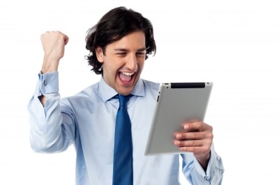 excited-businessman-holding-ipad